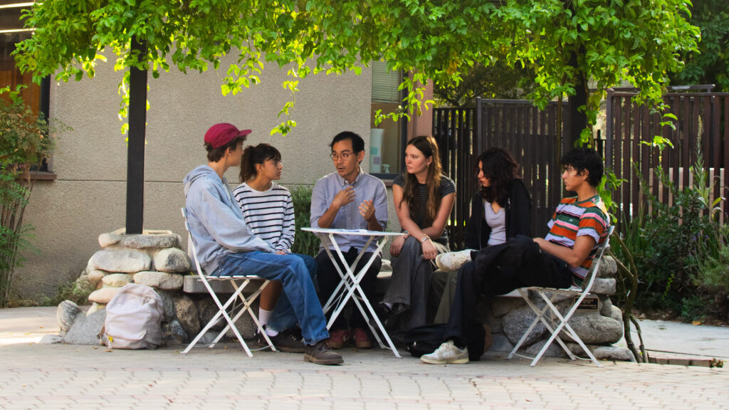Director of DEIJ and Community Engagement RJ Sakai (third from right) meets with high school student affinity conveners.